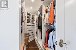 Primary bedroom walk-in closet - 