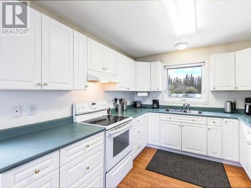 60 Tagish River Road, Whitehorse South, YT - Indoor Photo Showing Kitchen With Double Sink