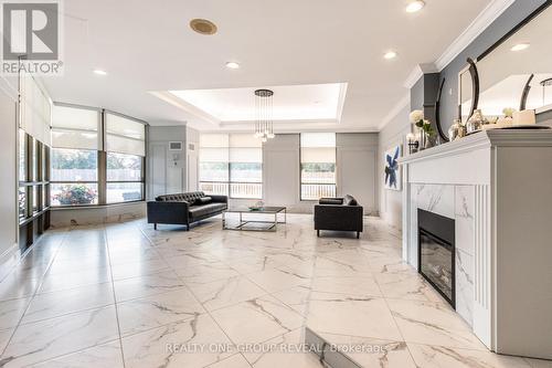 317 - 712 Rossland Road E, Whitby (Pringle Creek), ON - Indoor Photo Showing Other Room With Fireplace