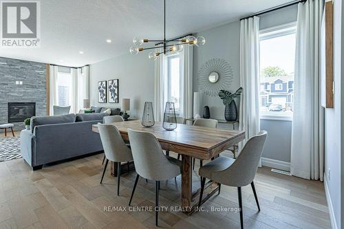 1255 Emma Chase Drive, London, ON - Indoor Photo Showing Dining Room With Fireplace