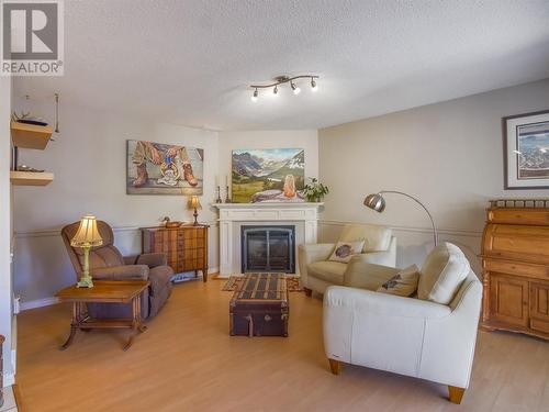 166 Heather Place, Penticton, BC - Indoor Photo Showing Living Room With Fireplace