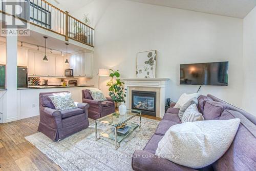 14 - 2141 Caroline Street, Burlington, ON - Indoor Photo Showing Living Room With Fireplace