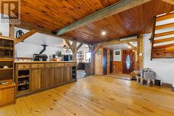 Kitchen seating area overlooks livingroom. Character woodwork! - 