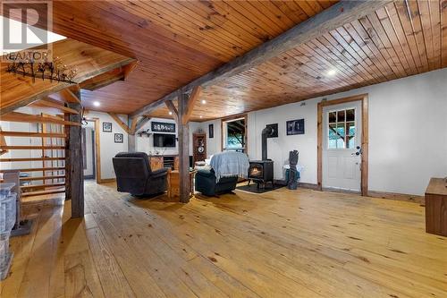 White door to porch. French door leads to main floor bedrooms/office. Large, open livingroom. - 5258 Murphy Road, Calabogie, ON - Indoor Photo Showing Other Room