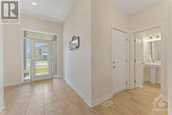 Front Foyer leading to powder & Garage - 