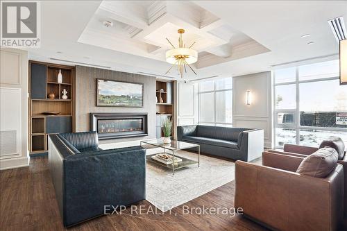 308 - 450 Dundas Street E, Hamilton (Waterdown), ON - Indoor Photo Showing Living Room With Fireplace