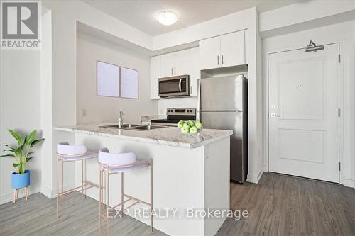 308 - 450 Dundas Street E, Hamilton (Waterdown), ON - Indoor Photo Showing Kitchen With Double Sink