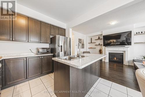 11 Mcwatters Street, Hamilton, ON - Indoor Photo Showing Kitchen With Fireplace With Double Sink