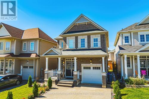 11 Mcwatters Street, Hamilton (Binbrook), ON - Outdoor With Deck Patio Veranda With Facade