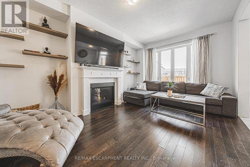 11 Mcwatters Street, Hamilton (Binbrook), ON - Indoor Photo Showing Living Room With Fireplace