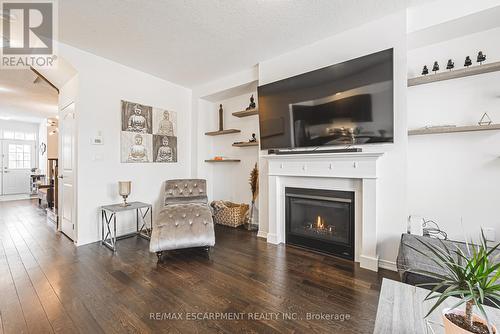 11 Mcwatters Street, Hamilton (Binbrook), ON - Indoor Photo Showing Living Room With Fireplace