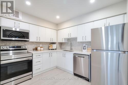 105 - 39 Kimbercroft Court, Toronto, ON - Indoor Photo Showing Kitchen