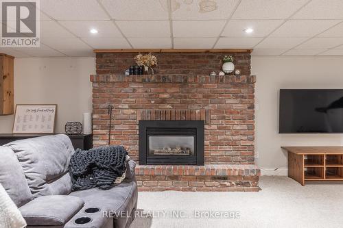 22 Tamarack Avenue, St. Catharines, ON - Indoor Photo Showing Living Room With Fireplace