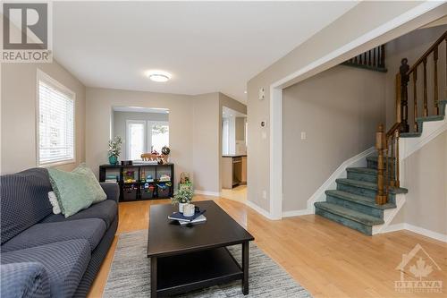 Circular staircase leads to the generous bedrooms, full main bath and large loft perfect for a home office, or convert it to a third bedroom. - 48 Eagleview Street, Ottawa, ON - Indoor Photo Showing Living Room