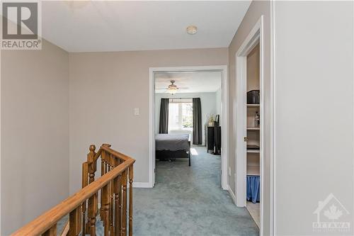 Circular staircase leads to the generous bedrooms, full main bath and large loft perfect for a home office, or convert it to a third bedroom. - 48 Eagleview Street, Ottawa, ON - Indoor Photo Showing Other Room