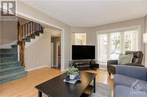 The main floor features a contemporary open-concept design and stunning maple hardwood floors. - 48 Eagleview Street, Ottawa, ON - Indoor Photo Showing Living Room