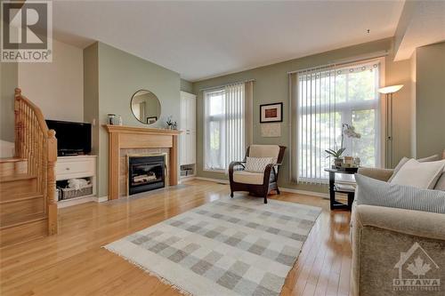 30 Pondside Private, Ottawa, ON - Indoor Photo Showing Living Room With Fireplace