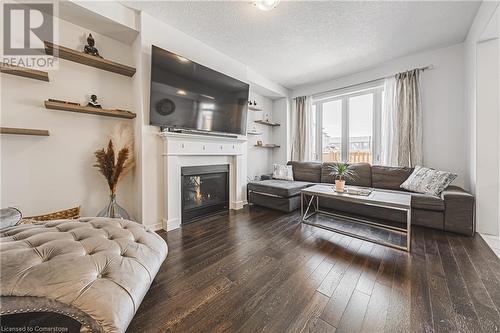 11 Mcwatters Street, Binbrook, ON - Indoor Photo Showing Living Room With Fireplace