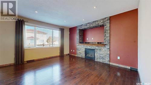 4022 Cumberland Road E, Regina, SK - Indoor Photo Showing Living Room With Fireplace