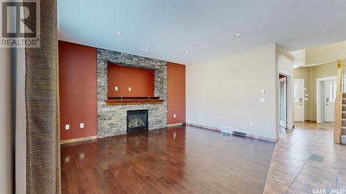 4022 Cumberland Road E, Regina, SK - Indoor Photo Showing Other Room With Fireplace