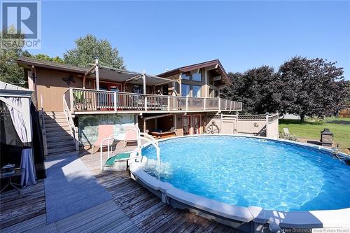 37 Carlisle Road, Douglas, NB - Outdoor With Above Ground Pool With Deck Patio Veranda