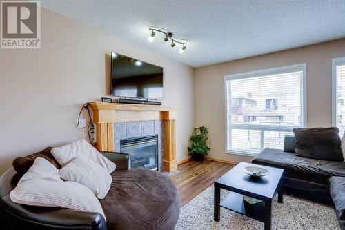 205 Coral Springs Close Ne, Calgary, AB - Indoor Photo Showing Living Room With Fireplace