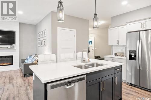 164 Newton Way, Saskatoon, SK - Indoor Photo Showing Kitchen With Stainless Steel Kitchen With Double Sink With Upgraded Kitchen