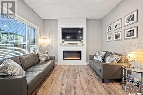 164 Newton Way, Saskatoon, SK - Indoor Photo Showing Living Room With Fireplace