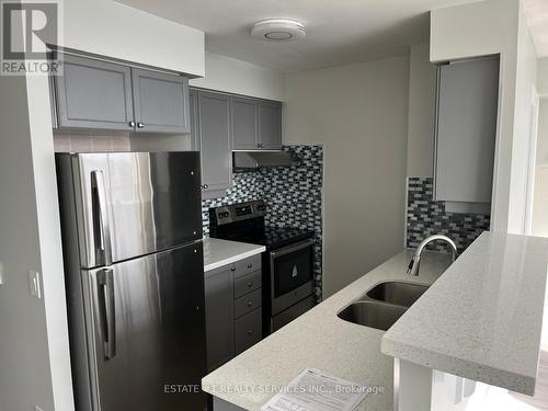 1506A - 710 Humberwood Boulevard, Toronto, ON - Indoor Photo Showing Kitchen With Double Sink