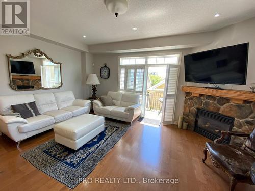 4 - 2 Cranberry Quay, Collingwood, ON - Indoor Photo Showing Living Room With Fireplace