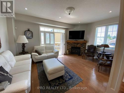 4 - 2 Cranberry Quay, Collingwood, ON - Indoor Photo Showing Living Room With Fireplace