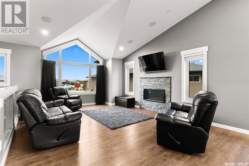 30 Dawn Bay, White City, SK - Indoor Photo Showing Living Room With Fireplace