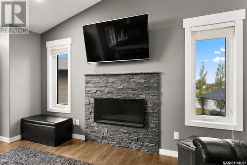 30 Dawn Bay, White City, SK - Indoor Photo Showing Living Room With Fireplace