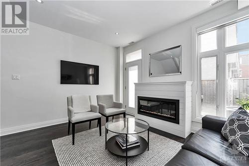 454 Churchill Avenue N, Ottawa, ON - Indoor Photo Showing Living Room With Fireplace