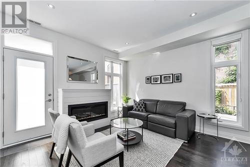 454 Churchill Avenue N, Ottawa, ON - Indoor Photo Showing Living Room With Fireplace