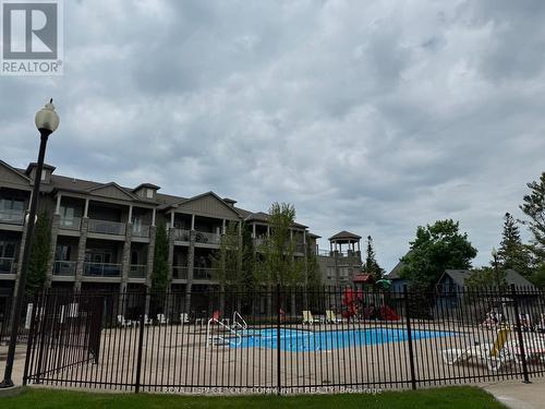 101 - 764 River Road E, Wasaga Beach, ON - Outdoor With In Ground Pool