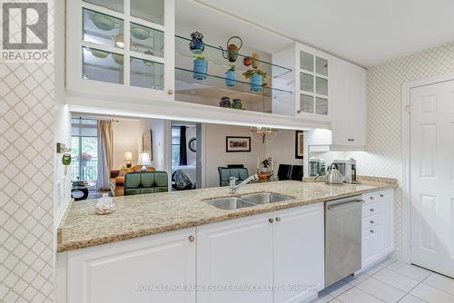 203 - 10 Old Mill Trail, Toronto, ON - Indoor Photo Showing Kitchen With Double Sink