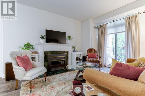 203 - 10 Old Mill Trail, Toronto (Kingsway South), ON - Indoor Photo Showing Living Room With Fireplace