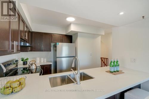 12 - 2614 Dashwood Drive, Oakville, ON - Indoor Photo Showing Kitchen With Stainless Steel Kitchen With Double Sink