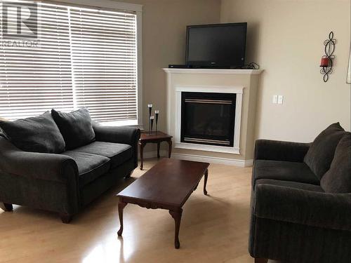 Living Room V2 - 28, 411 Williams Drive, Fort Mcmurray, AB - Indoor Photo Showing Living Room With Fireplace