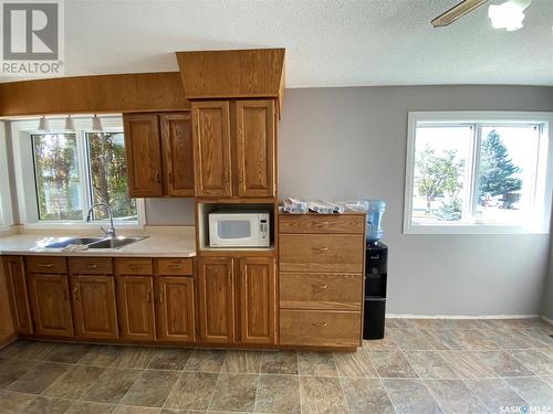 1004 1St Street W, Kindersley, SK - Indoor Photo Showing Kitchen With Double Sink