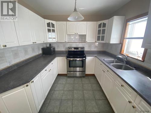 59 Mckelvie Ave, Kirkland Lake, ON - Indoor Photo Showing Kitchen With Double Sink