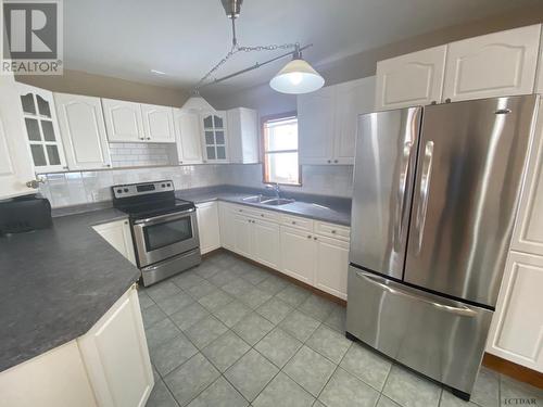 59 Mckelvie Ave, Kirkland Lake, ON - Indoor Photo Showing Kitchen With Double Sink