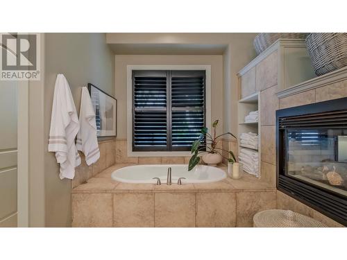 1749 Capistrano Drive, Kelowna, BC - Indoor Photo Showing Bathroom With Fireplace