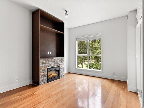 705-1400 Lynburne Pl, Langford, BC - Indoor Photo Showing Living Room With Fireplace