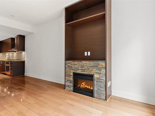 705-1400 Lynburne Pl, Langford, BC - Indoor Photo Showing Living Room With Fireplace