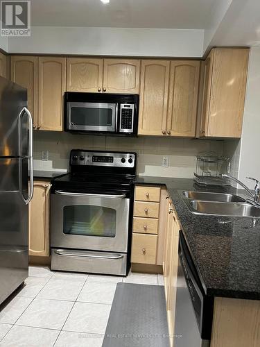 502 - 4889 Kimbermount Avenue, Mississauga, ON - Indoor Photo Showing Kitchen With Double Sink