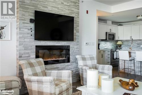 309 - 1 Chamberlain Crescent, Collingwood, ON - Indoor Photo Showing Living Room With Fireplace