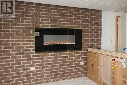 654 White Rock Road, Kawartha Lakes (Oakwood), ON - Indoor Photo Showing Other Room With Fireplace