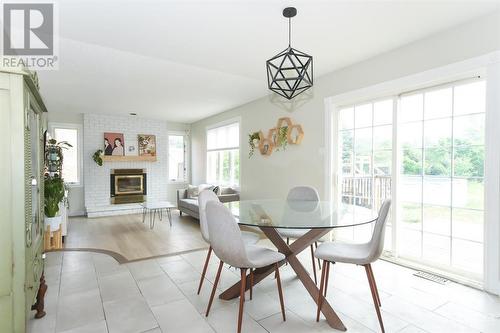 1467 Spartan Grove Street, Ottawa, ON - Indoor Photo Showing Dining Room With Fireplace